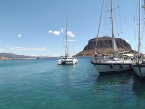 Tantrum pulling out of the marina with the rock of Monemvasia in the background.
