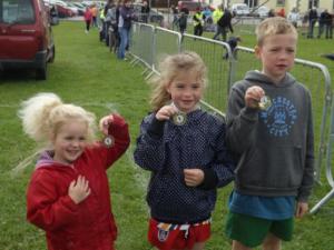 Lily, Jess and Charlie all win medals at the local sports day in Glencolmcille, Donegal.