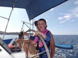 A Small Viking at the helm.